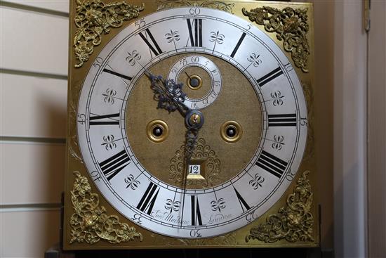 Sam Macham of London. A William and Mary mulberry cased eight-day longcase clock, 7ft. 2in. (plinth altered, parts replaced)